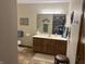 Neutral-toned bathroom featuring a large mirror, light fixtures, and plenty of storage space at 5122 Montpelier Ct, Columbus, IN 47203