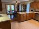 Spacious kitchen featuring wood cabinetry, lots of counter space and an eat in dining area at 5122 Montpelier Ct, Columbus, IN 47203