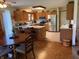 Eat-in kitchen featuring wood cabinetry, stainless appliances, and a tile backsplash at 5122 Montpelier Ct, Columbus, IN 47203