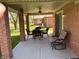 Covered patio with outdoor seating, perfect for entertaining or relaxing at 5122 Montpelier Ct, Columbus, IN 47203