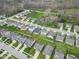 A beautiful suburban neighborhood offering green lawns, fenced backyards, and manicured landscaping at 5157 Climbing Rose Pl, Indianapolis, IN 46254