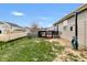 Large yard features a wooden deck, fenced perimeter and grassy lawn at 5157 Climbing Rose Pl, Indianapolis, IN 46254