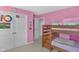 Charming bedroom with bunk beds, a door to the closet, and a cheerful decor creating a playful atmosphere at 5157 Climbing Rose Pl, Indianapolis, IN 46254