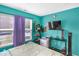 Bedroom with brightly painted walls, double window, carpet flooring, side table, and media console at 5157 Climbing Rose Pl, Indianapolis, IN 46254