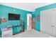 Bedroom featuring brightly painted walls, a TV, closet, and carpet flooring at 5157 Climbing Rose Pl, Indianapolis, IN 46254
