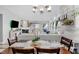 Elegant dining area with views into the living room, creating a warm, inviting atmosphere for meals and socializing at 5157 Climbing Rose Pl, Indianapolis, IN 46254