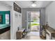 Foyer featuring an open view to the front door and an adjacent living space at 5157 Climbing Rose Pl, Indianapolis, IN 46254