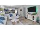 Cozy living room features an open layout with adjacent kitchen, perfect for entertaining and everyday living at 5157 Climbing Rose Pl, Indianapolis, IN 46254