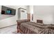 Bedroom features neutral tones, vaulted ceiling, walk in closet, carpet, and television at 5298 Royal Troon Way, Avon, IN 46123