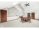 Bonus room featuring skylights, vaulted ceiling, and updated flooring at 5298 Royal Troon Way, Avon, IN 46123