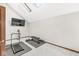 This exercise room has a vaulted ceiling with skylights and neutral carpeting at 5298 Royal Troon Way, Avon, IN 46123