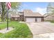 Beautiful two-story home featuring a brick exterior, attached three-car garage, and a green front yard at 5298 Royal Troon Way, Avon, IN 46123