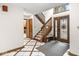 Welcoming foyer featuring tile flooring, a staircase, and an elegant front door at 5298 Royal Troon Way, Avon, IN 46123