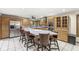 Expansive kitchen featuring a large island with bar seating and stainless steel appliances at 5298 Royal Troon Way, Avon, IN 46123