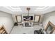 Aerial view of living room featuring fireplace, ceiling fan, skylights and leather sofa at 5298 Royal Troon Way, Avon, IN 46123