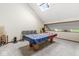 Carpeted game room area with pool table, chairs, video game and skylight at 5298 Royal Troon Way, Avon, IN 46123
