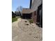 Serene walkway alongside the house, featuring a rock garden and lush greenery at 5298 Royal Troon Way, Avon, IN 46123