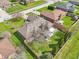A beautiful aerial view of a well-maintained house with a huge yard and mature trees on a sunny day at 5325 Tracey Jo Rd, Greenwood, IN 46142