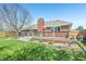 Well-maintained backyard featuring mature trees, lawn and a deck at 5325 Tracey Jo Rd, Greenwood, IN 46142