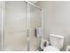 Bathroom featuring a shower with glass doors, a toilet, and a towel at 5325 Tracey Jo Rd, Greenwood, IN 46142