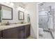 Well-appointed bathroom is complete with granite countertops, double sinks, and a shower for a spa-like retreat at 5325 Tracey Jo Rd, Greenwood, IN 46142