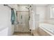 Spacious bathroom showcases a glass enclosed shower, a soaking tub, and modern fixtures for a touch of luxury at 5325 Tracey Jo Rd, Greenwood, IN 46142