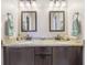 Modern bathroom features a double vanity, granite countertops, and contemporary fixtures for a stylish space at 5325 Tracey Jo Rd, Greenwood, IN 46142