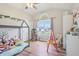 Cheerful room with hardwood floors, natural light and plenty of play area, is designed for comfort and fun at 5325 Tracey Jo Rd, Greenwood, IN 46142