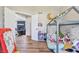 A room with hardwood flooring, play furniture, and an open entranceway at 5325 Tracey Jo Rd, Greenwood, IN 46142