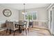 Charming dining room is filled with natural light, complemented by elegant decor and views of the outdoors at 5325 Tracey Jo Rd, Greenwood, IN 46142