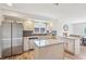 Bright kitchen featuring an island, stainless steel appliances, and a dining area in the background at 5325 Tracey Jo Rd, Greenwood, IN 46142