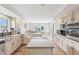 Bright kitchen features granite countertops, stainless steel appliances, and a large island, creating a perfect cooking space at 5325 Tracey Jo Rd, Greenwood, IN 46142