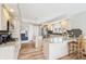 Well-lit kitchen boasting updated countertops, stainless steel appliances, and ample cabinet space at 5325 Tracey Jo Rd, Greenwood, IN 46142
