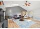 Spacious living room with a fireplace, skylight, hardwood floors, and an open layout at 5325 Tracey Jo Rd, Greenwood, IN 46142