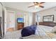 Comfortable main bedroom showcases plush carpeting, ample natural light, and well-appointed furnishings for peaceful living at 5325 Tracey Jo Rd, Greenwood, IN 46142