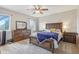 Relaxing main bedroom is complete with a ceiling fan, a large window, and generous closet space at 5325 Tracey Jo Rd, Greenwood, IN 46142