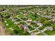 Aerial view showcasing a neighborhood with lush greenery, spacious yards, and well-maintained homes in a serene setting at 5341 W Stonehaven Ln, New Palestine, IN 46163
