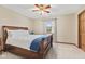 Primary bedroom with a queen bed, a ceiling fan, carpet, and natural light at 5341 W Stonehaven Ln, New Palestine, IN 46163