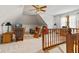 Bonus room with a vaulted ceiling, carpet, rocking chairs, and views of the exterior at 5341 W Stonehaven Ln, New Palestine, IN 46163