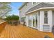 Spacious wooden deck with outdoor seating, perfect for entertaining and enjoying the beautiful backyard view at 5341 W Stonehaven Ln, New Palestine, IN 46163