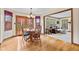 Cozy dining area with wood floors, chandelier, and direct access to the living room at 5341 W Stonehaven Ln, New Palestine, IN 46163