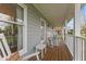 Inviting covered porch with rocking chairs, offering a cozy outdoor space for relaxing and enjoying the view at 5341 W Stonehaven Ln, New Palestine, IN 46163