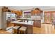Bright kitchen with stainless steel appliances, wood cabinets, and ample counter space at 5341 W Stonehaven Ln, New Palestine, IN 46163