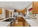 Updated kitchen with stainless steel appliances and countertops and wood cabinetry at 5341 W Stonehaven Ln, New Palestine, IN 46163