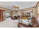 Spacious living room with wood trim and comfortable seating with open floorplan at 5341 W Stonehaven Ln, New Palestine, IN 46163