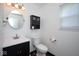 Bright bathroom features a vanity, toilet, and a medicine cabinet at 5424 Milhouse Rd, Indianapolis, IN 46221