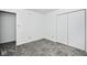 This bedroom has double doors and neutral walls and carpeting at 5424 Milhouse Rd, Indianapolis, IN 46221