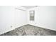 Bedroom with a window and neutral carpeting at 5424 Milhouse Rd, Indianapolis, IN 46221