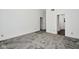 A bright bedroom offers soft carpet, light walls and an entrance to an ensuite at 5424 Milhouse Rd, Indianapolis, IN 46221