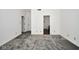 A cozy bedroom with fresh carpet, neutral walls and an ensuite bathroom at 5424 Milhouse Rd, Indianapolis, IN 46221